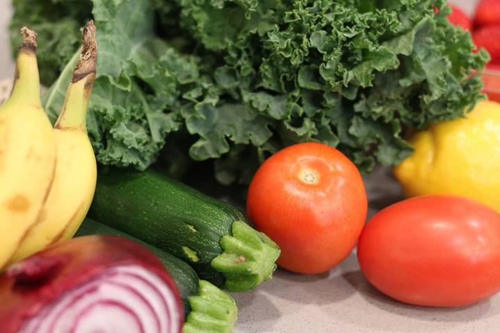 Groceries lay on a kitchen counter before being sorted for storage in the pantry and refrigerat ...