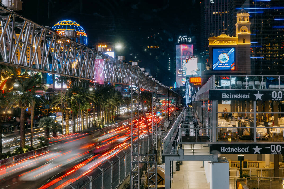 Traffic moves past temporary grandstands in front of the Bellagio along Las Vegas Boulevard on ...