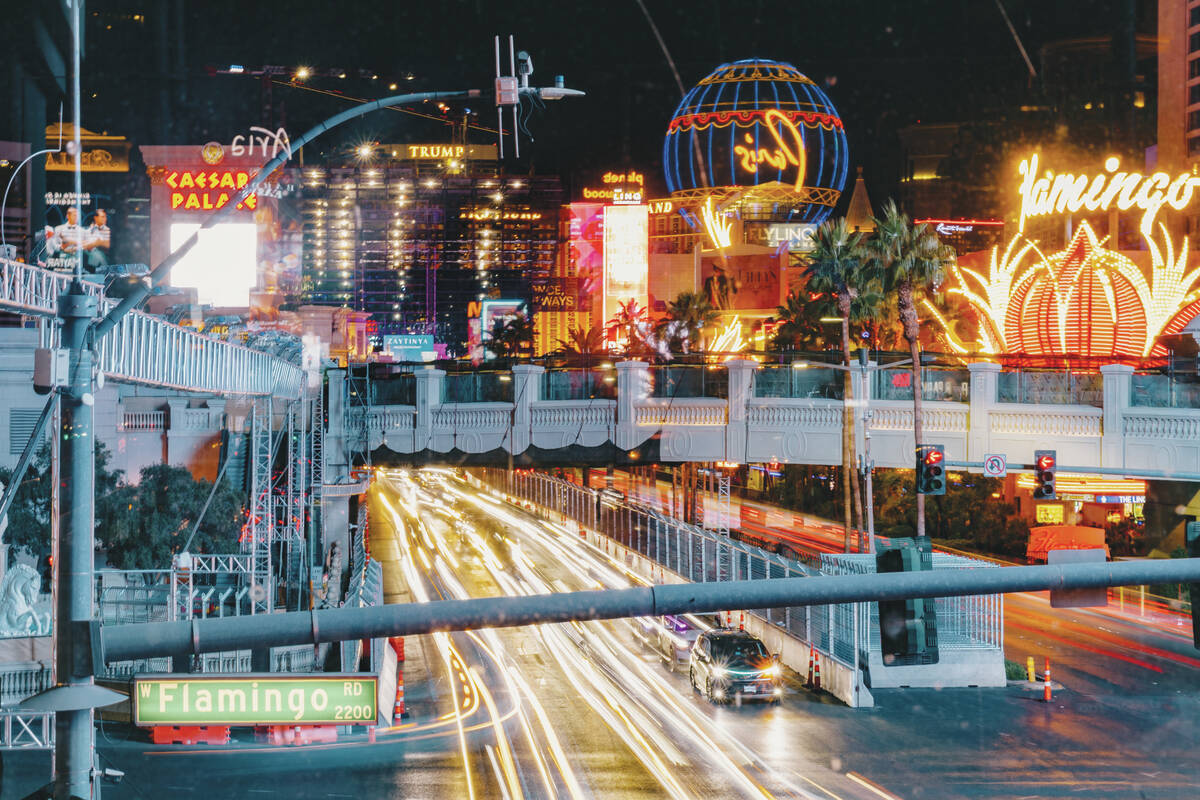 Traffic moves through the intersection of Las Vegas Boulevard and Flamingo Road on Thursday, No ...
