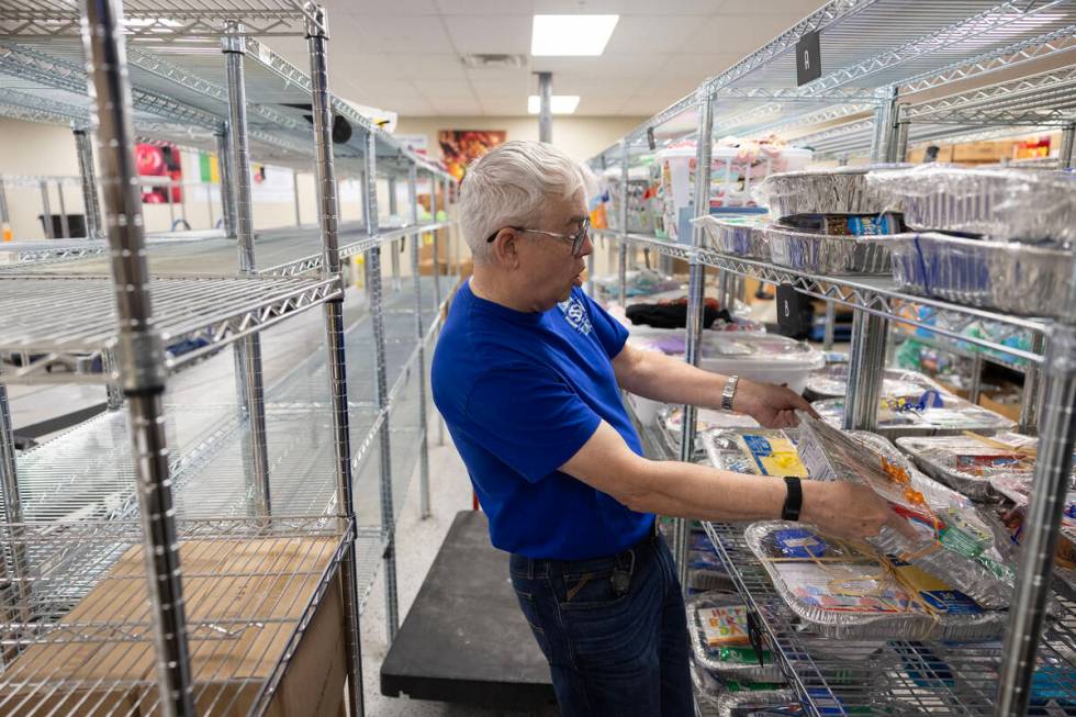 Tim Bedwell, CEO of Lutheran Social Services of Nevada, shows gift baskets that the nonprofit g ...