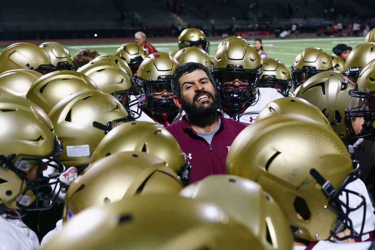 Faith Lutheran head coach Jay Staggs congratulates his team after the Crusaders’ 17-7 wi ...