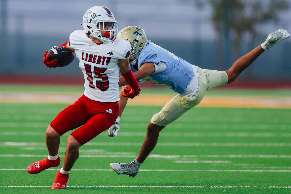 Liberty wide receiver Champion-James Ualesi (15) runs the ball during a high school football ga ...
