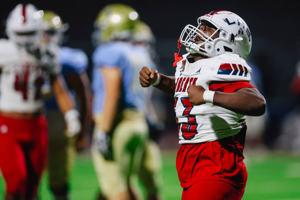 Liberty defensive end Jonathan Ioane celebrates during a high school football game between Libe ...
