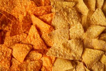 This image provided by PepsiCo shows from left, shows original Doritos Nacho cheese chips next ...