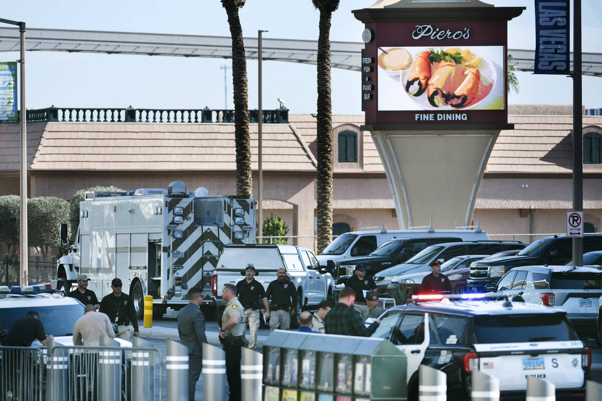 Las Vegas police investigate the area around Piero’s restaurant after an explosive devic ...