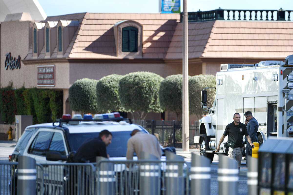 Las Vegas police investigate the area around Piero’s restaurant after an explosive devic ...