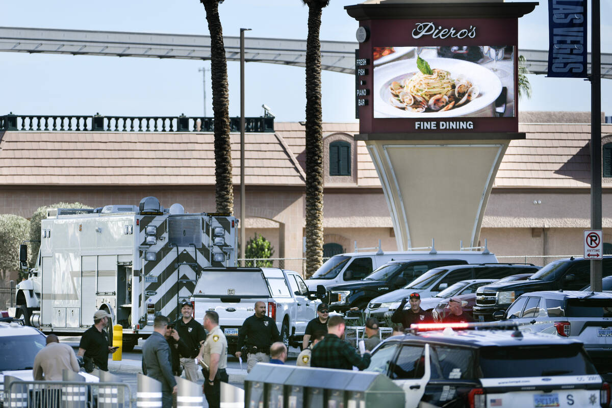 Las Vegas police investigate the area around Piero’s restaurant after an explosive devic ...