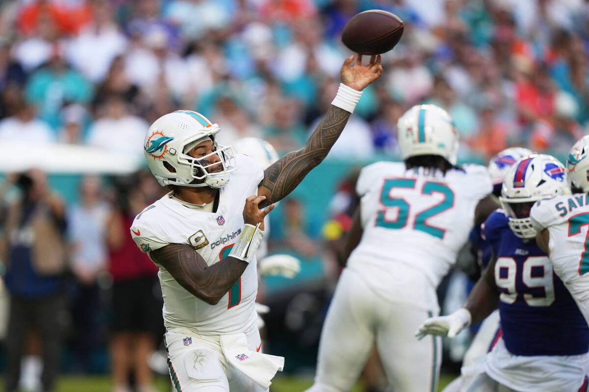 Miami Dolphins quarterback Tua Tagovailoa (1) passes during the second half of an NFL football ...