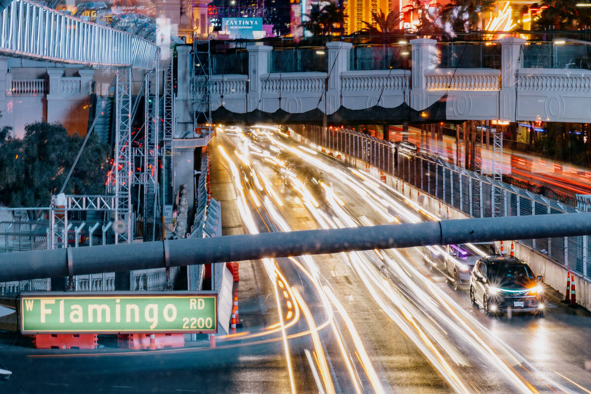 Traffic moves through the intersection of Las Vegas Boulevard and Flamingo Road on Thursday, No ...