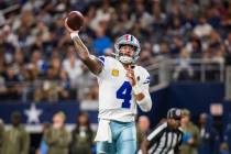 Dallas Cowboys quarterback Dak Prescott throws a pass during an NFL football game against the A ...