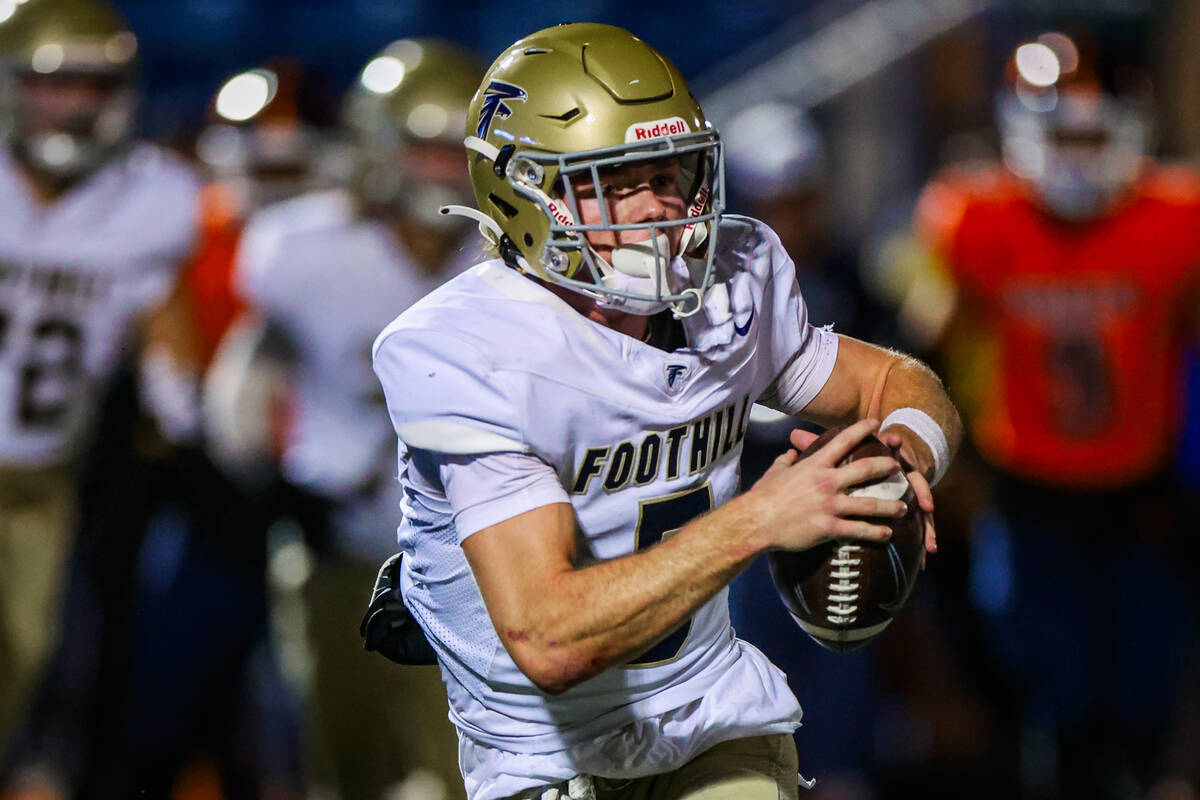 Foothill wide receiver Braxton Bonnett carries the ball during a Open Division high school foot ...