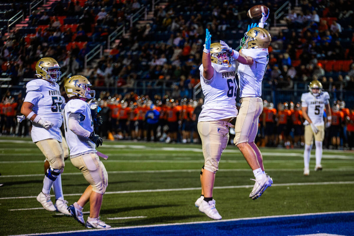 Foothill players celebrate a touchdown during a Open Division high school football playoff game ...