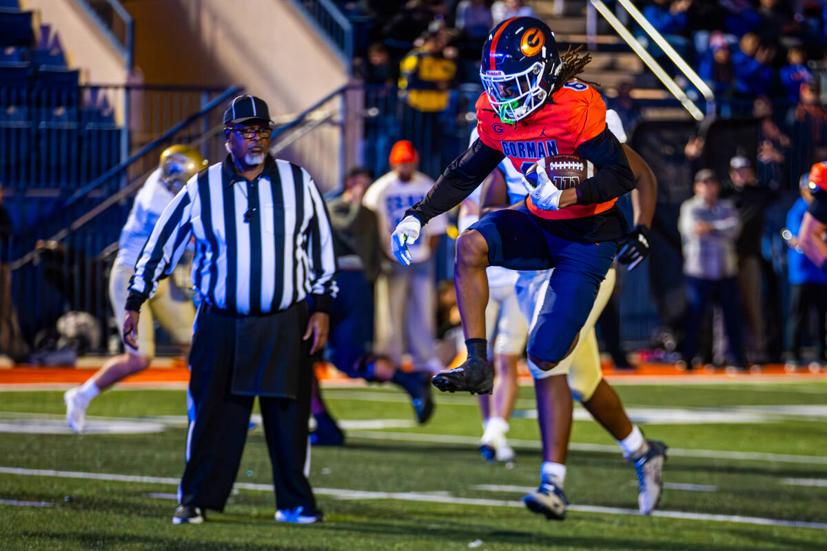 Bishop Gorman wide receiver Massiah Mingo leaps as he runs for a touchdown during a Open Divisi ...