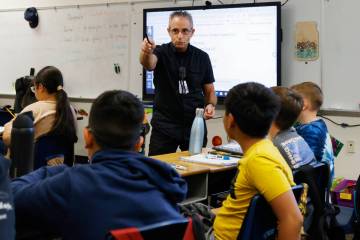 Roger Becker, a fifth-grade math teacher at Richard Bryan Elementary School, teaches on Tuesday ...