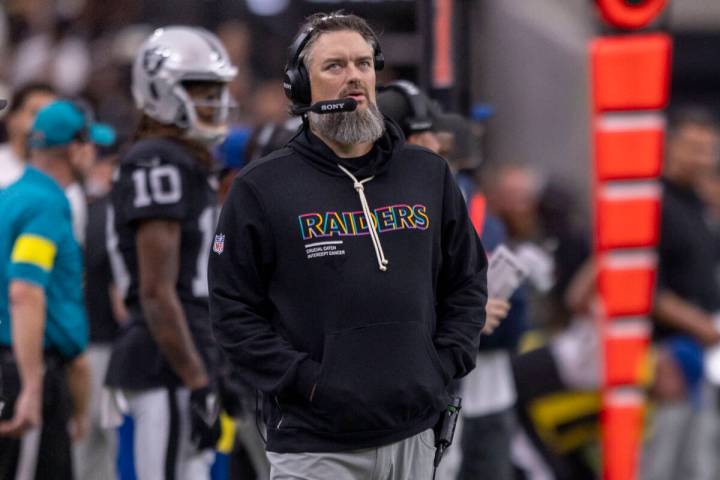 Raiders offensive line coach Brennan Carroll on the sideline during the first half of an NFL ga ...