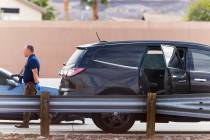 The side window of an SUV is shattered where Incident vehicles remain as the Henderson Police D ...