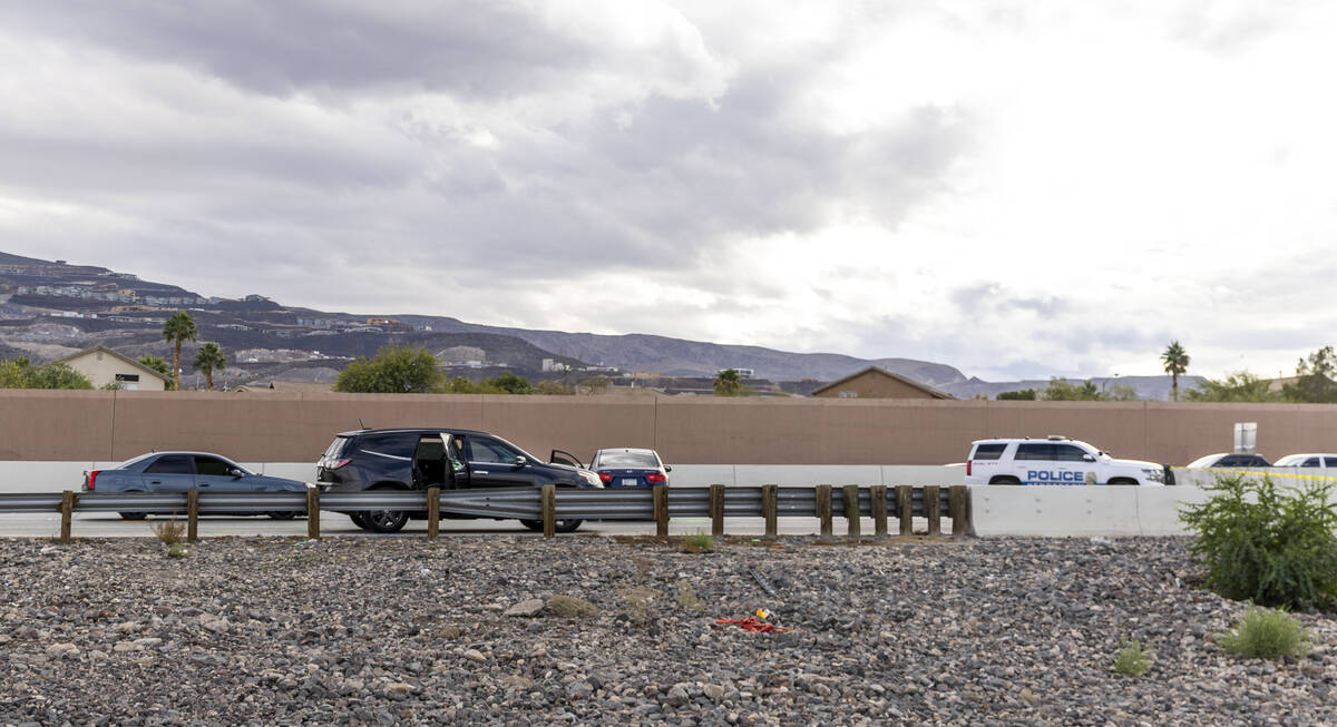 The side window of an SUV is shattered as the Henderson Police Department investigates the deat ...