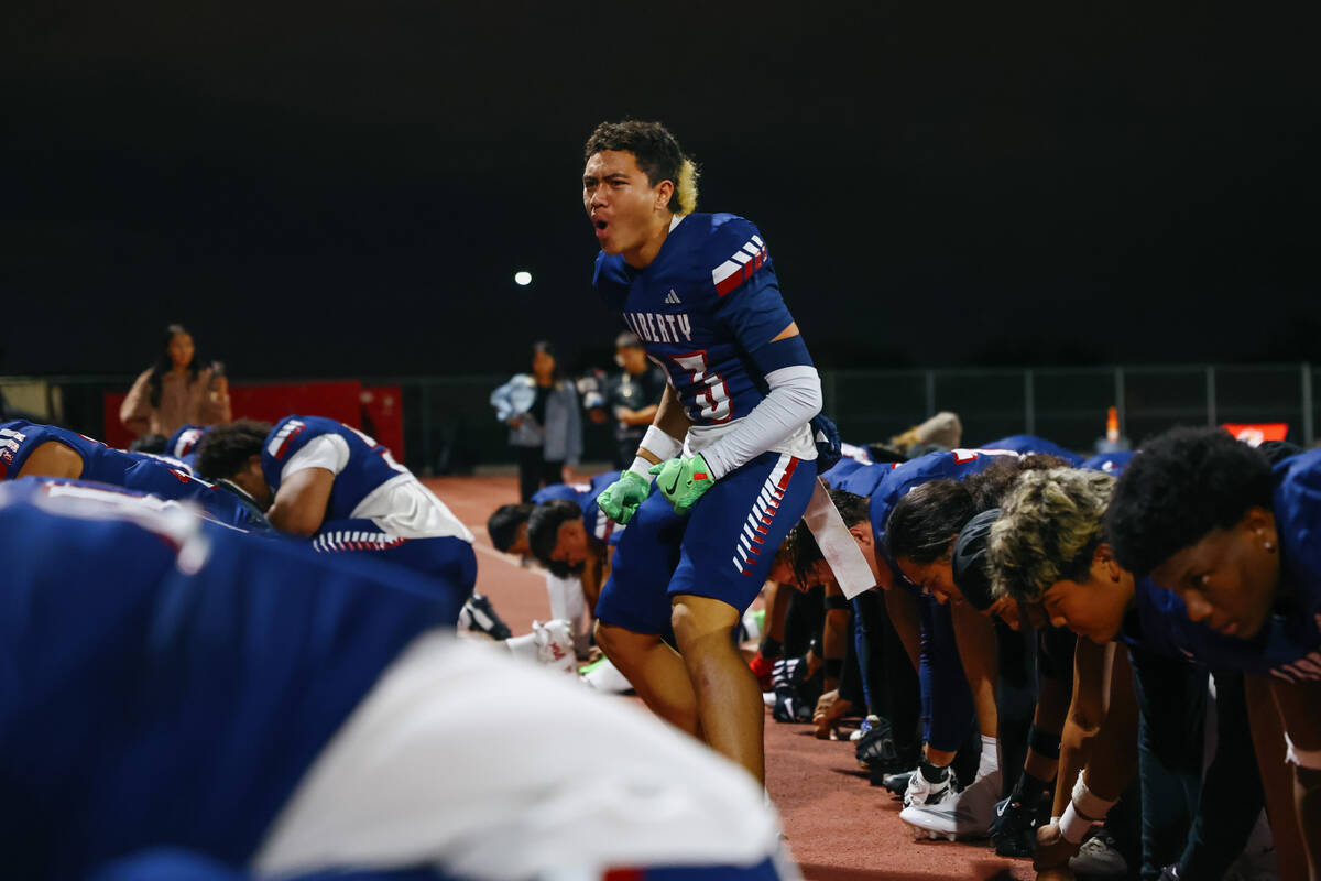 Liberty defensive back Rysen Dacosin-Arcala (23) leads a haka dance before the open division st ...