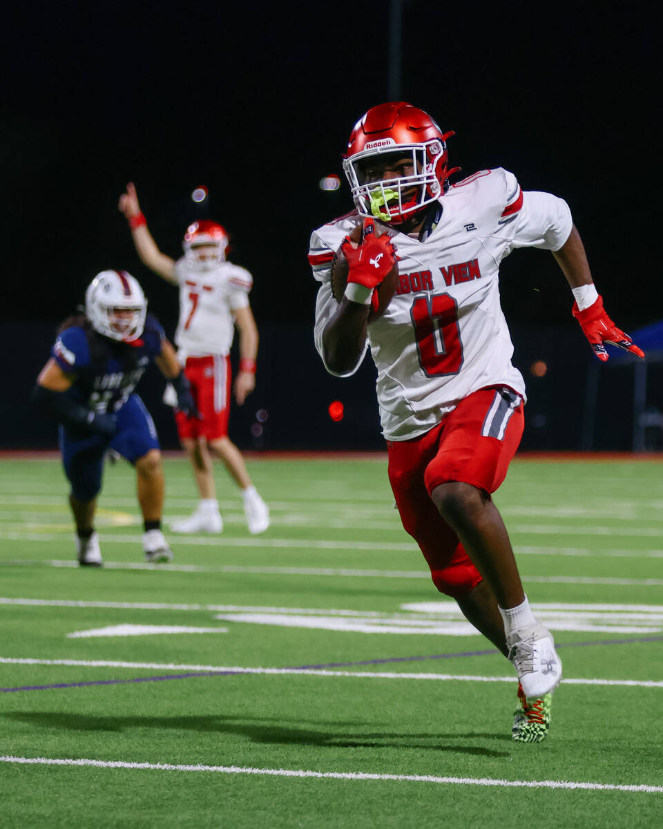 Arbor View running back Kamareion Bell (0) runs upfield during the open division state semifina ...