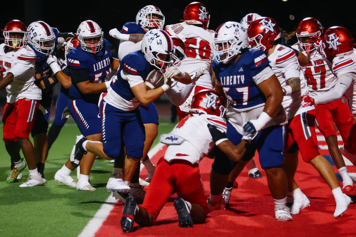 Liberty running back Anthony Alberro (24) makes it in for a touchdown during the open division ...