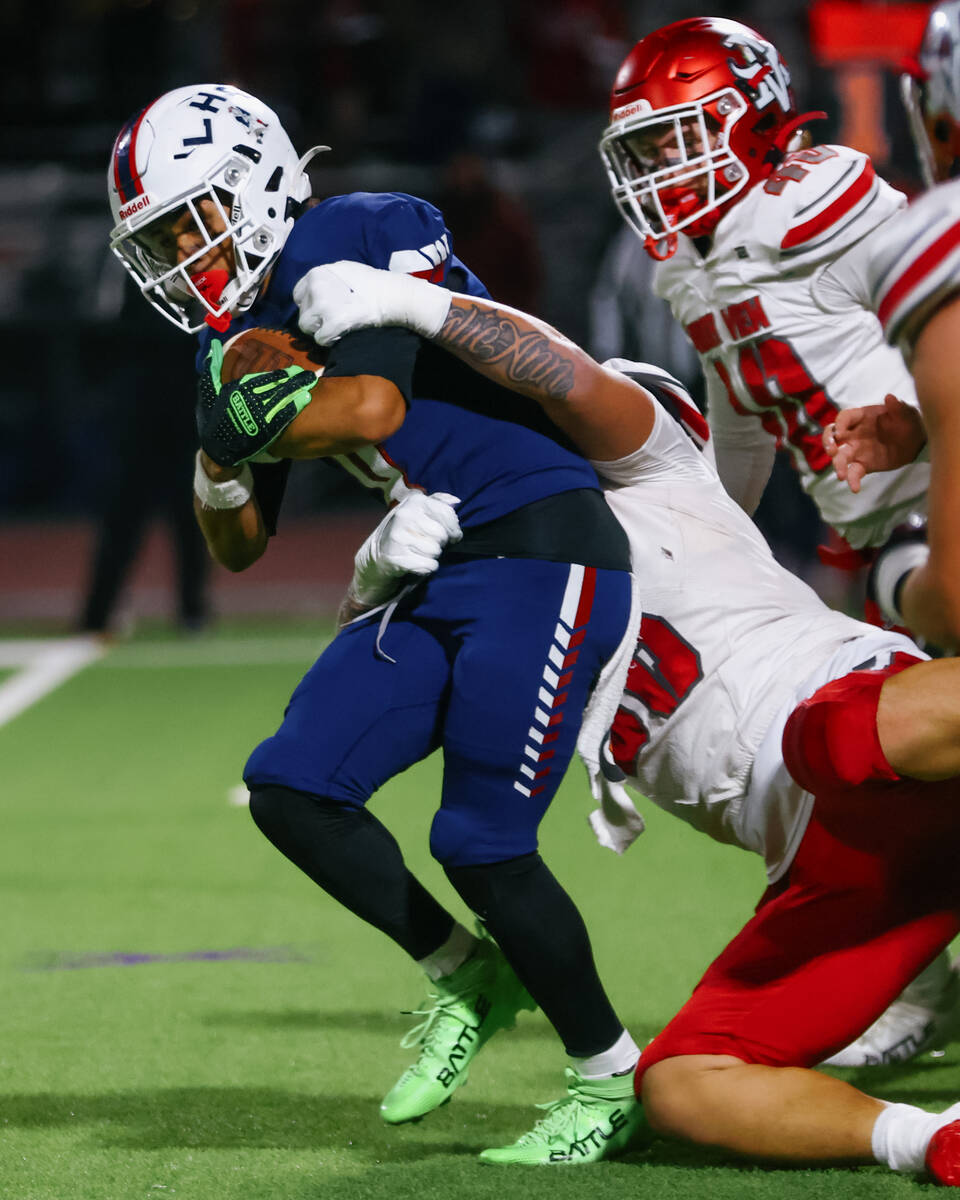 Liberty wide receiver Kaden Cadang (4) struggles against a tackle during the open division stat ...