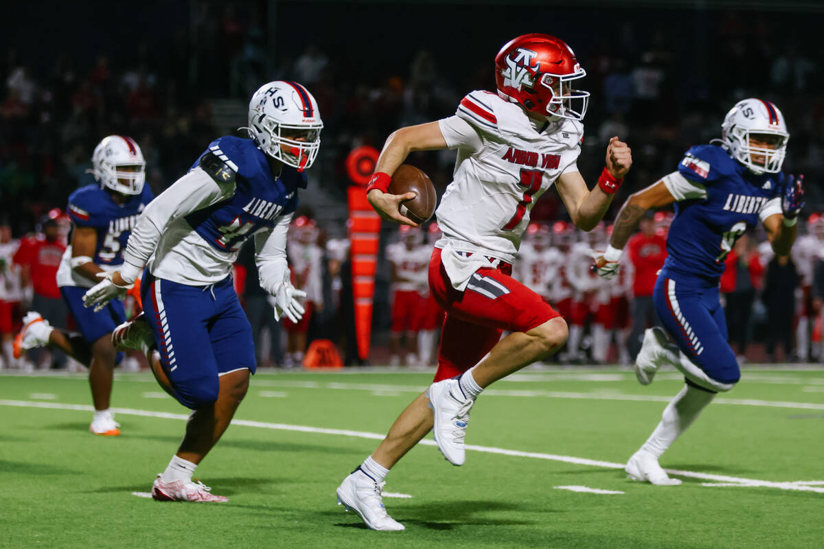Arbor View quarterback Thaddeus Thatcher (7) runs around the Liberty defense during the open di ...