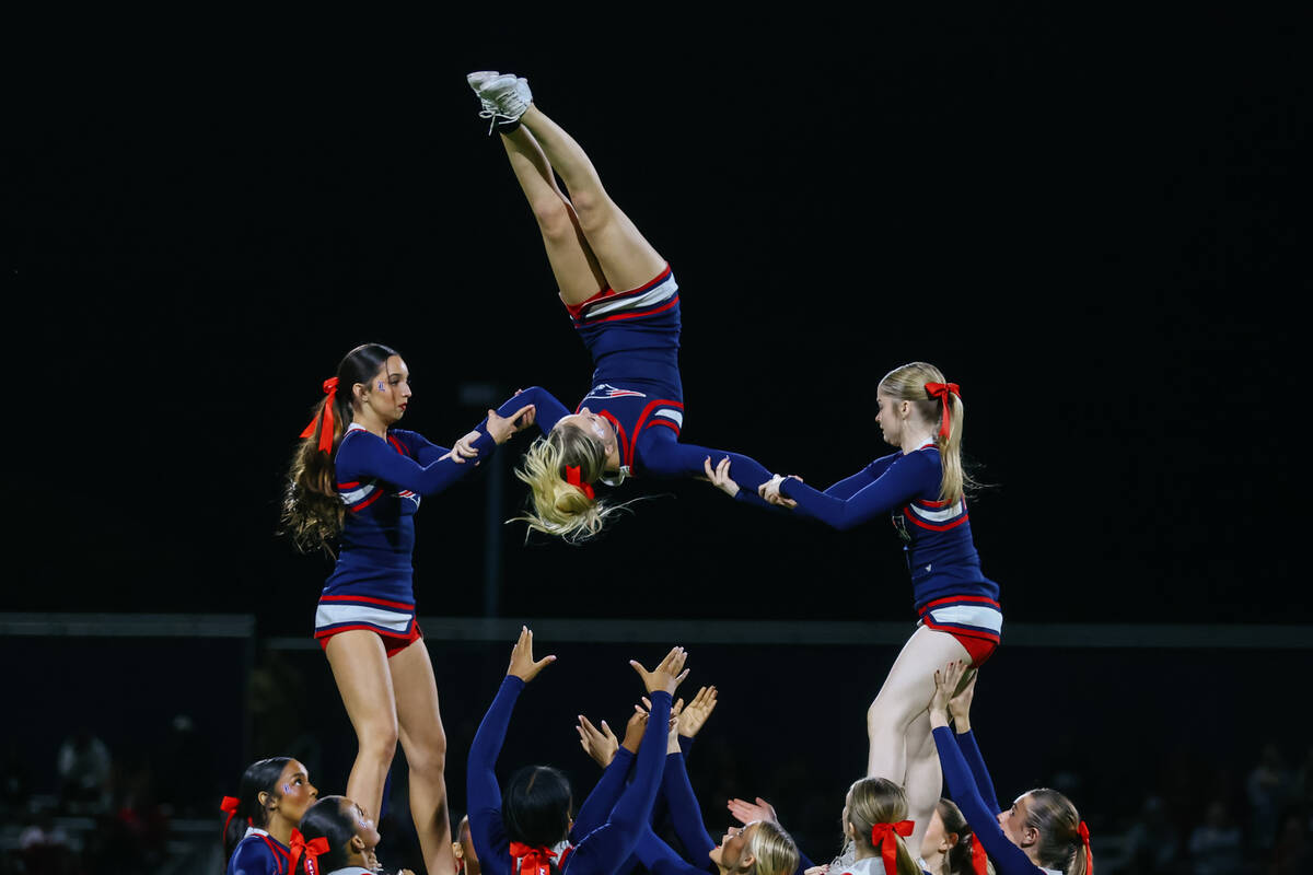 Liberty cheerleaders do a halftime routine during the open division state semifinal on Friday, ...