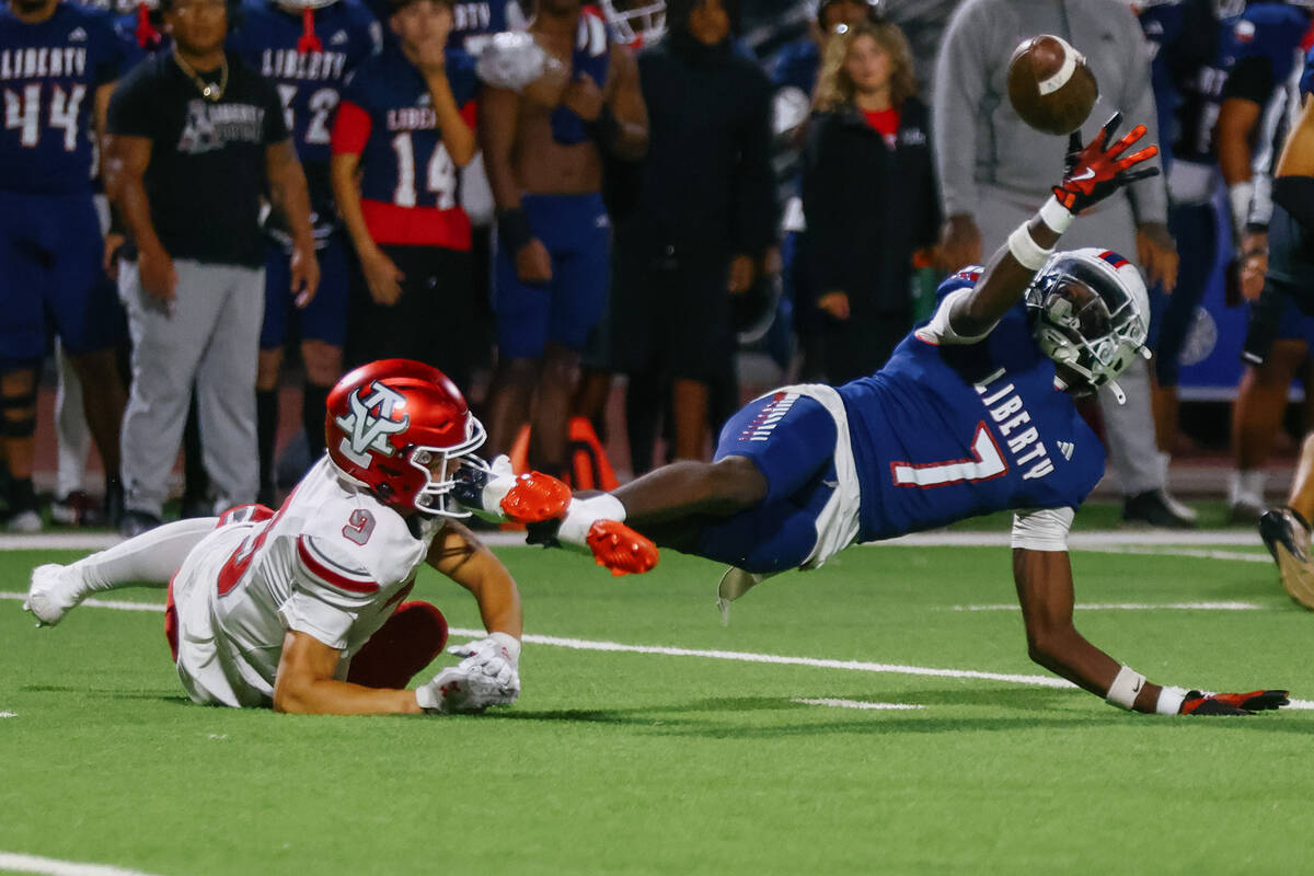 Liberty’s Ameche Baldwin (7) breaks up a pass intended for Arbor View wide receiver Kai ...