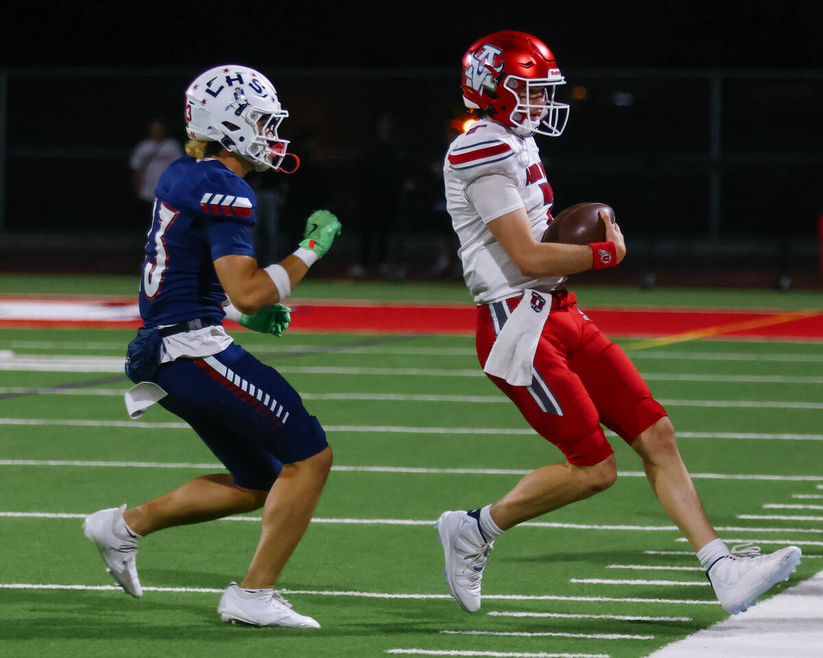 Liberty defensive back Rysen Dacosin-Arcala (23) runs Arbor View quarterback Thaddeus Thatcher ...