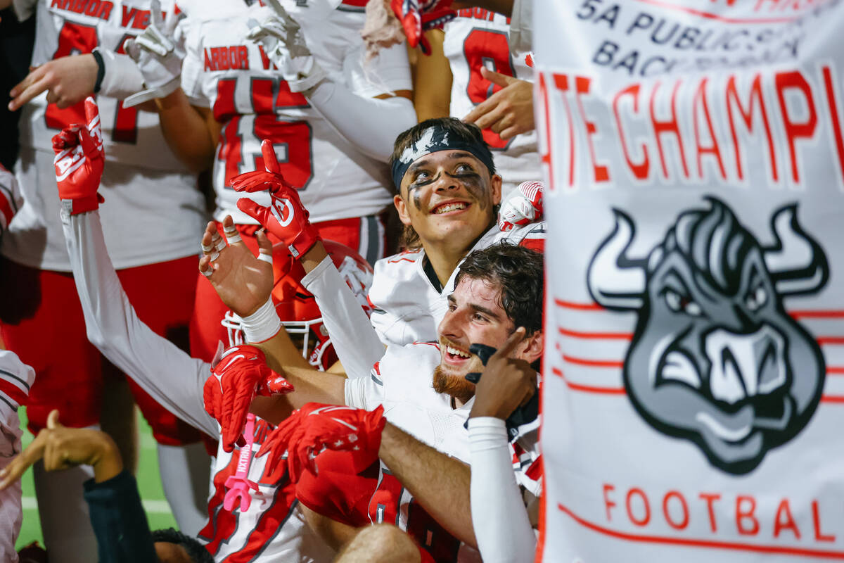 Arbor View’s Quintin Longmire (29), center, sits amid his teammates as they celebrate th ...