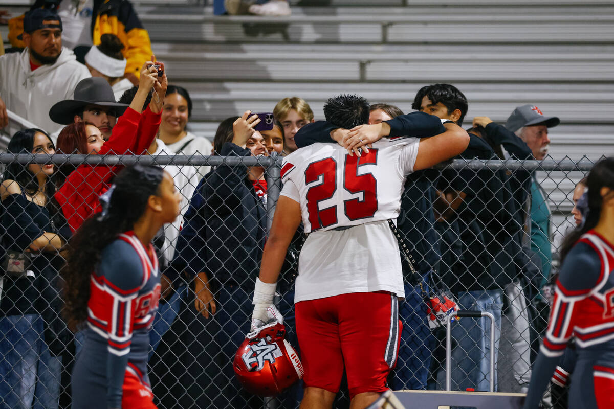 Arbor View’s Brandon Garcia (25) hugs loved ones after winning the open division state s ...