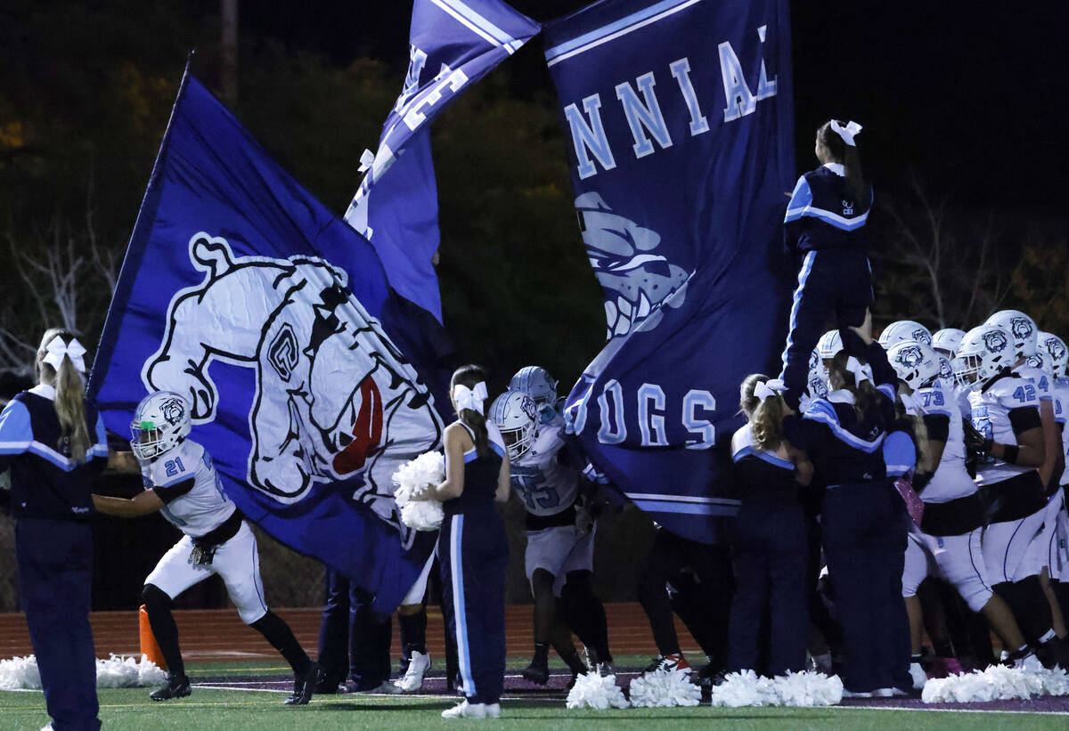 Centennial players take the field to face Faith Lutheran during a Class 5A Southern Region titl ...