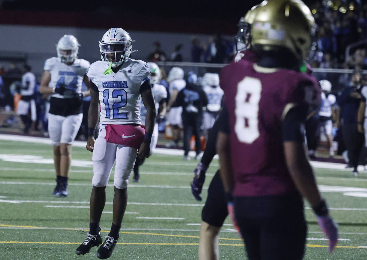 Centennial quarterback Nehemiah Dunlap-Myvett (12) celebrates his touchdown against Faith Luthe ...