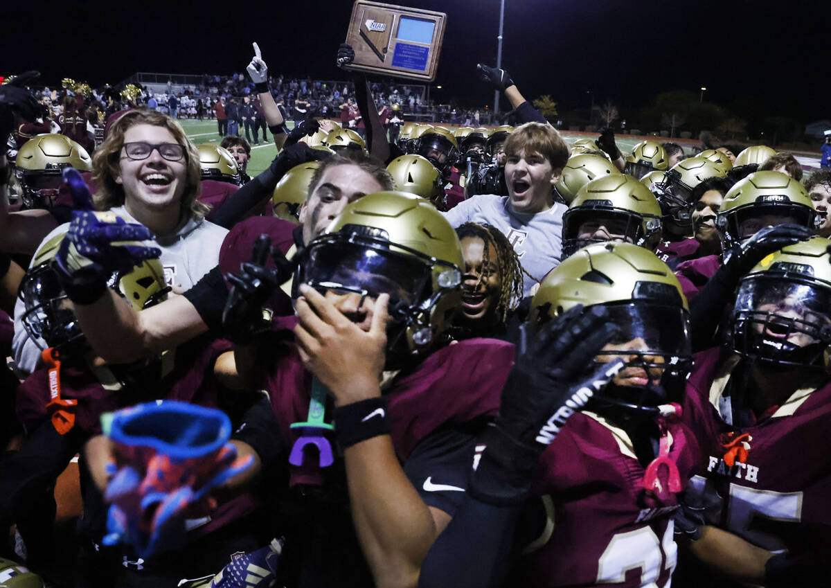 Faith Lutheran players celebrate after defeating Centennial in a Class 5A Southern Region title ...