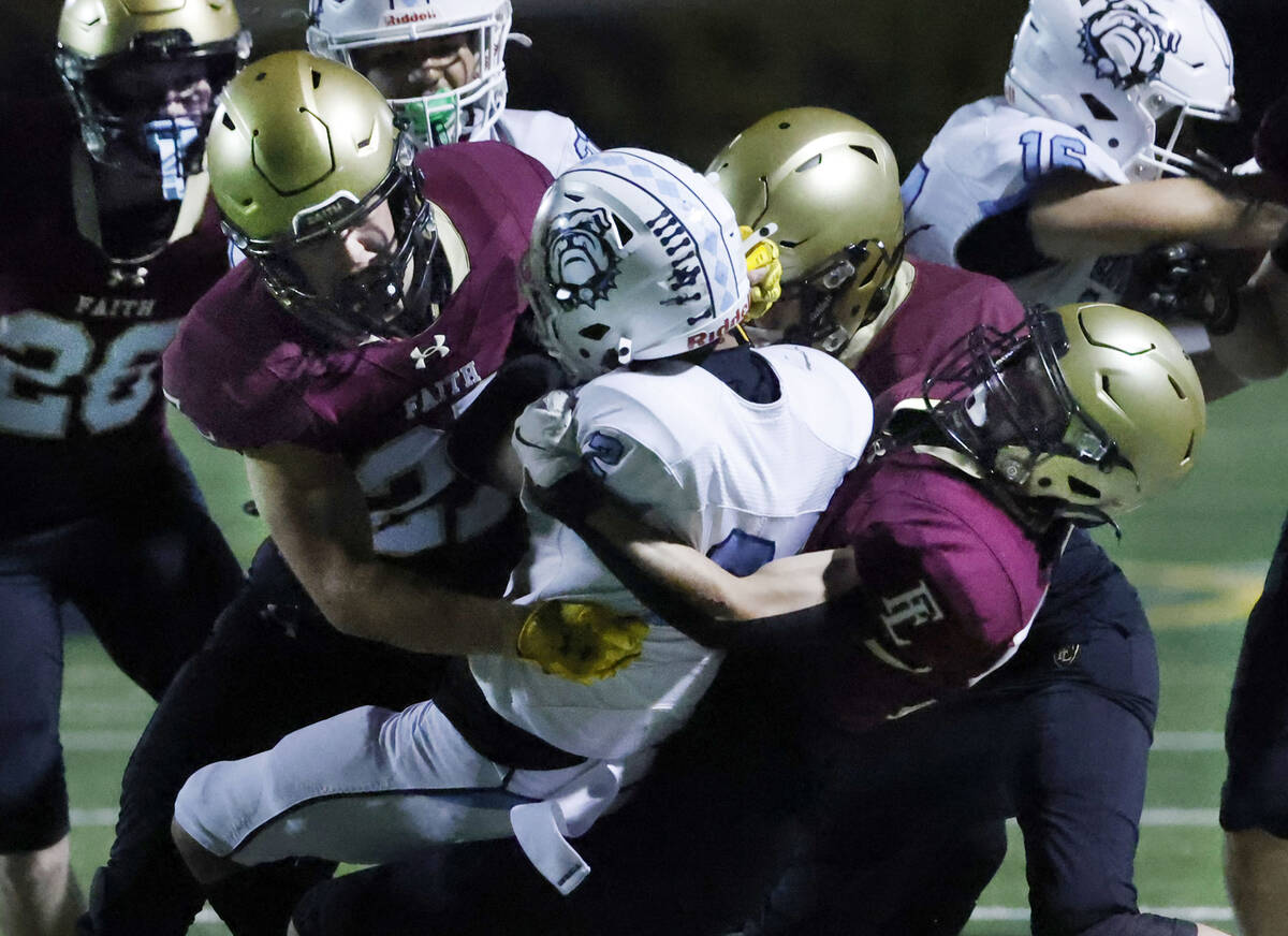 Centennial widereceiver is taken down by Fiath Lutheran defense during a Class 5A Southern Regi ...