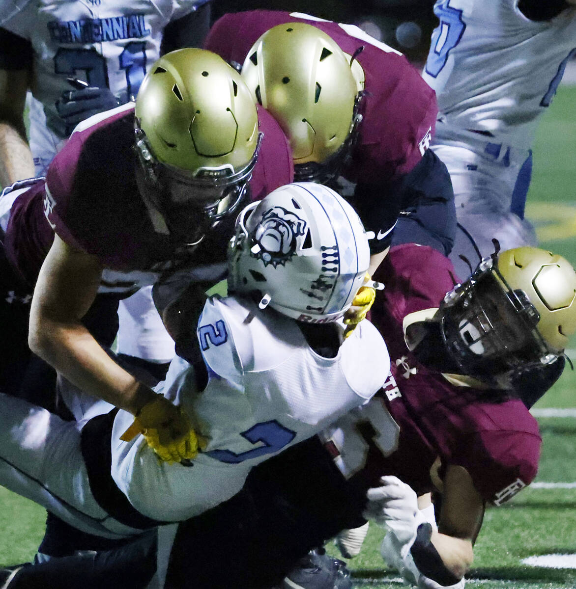 Centennial wide receiver Jordan Bostick (2) is taken down by Fiath Lutheran defense during a Cl ...