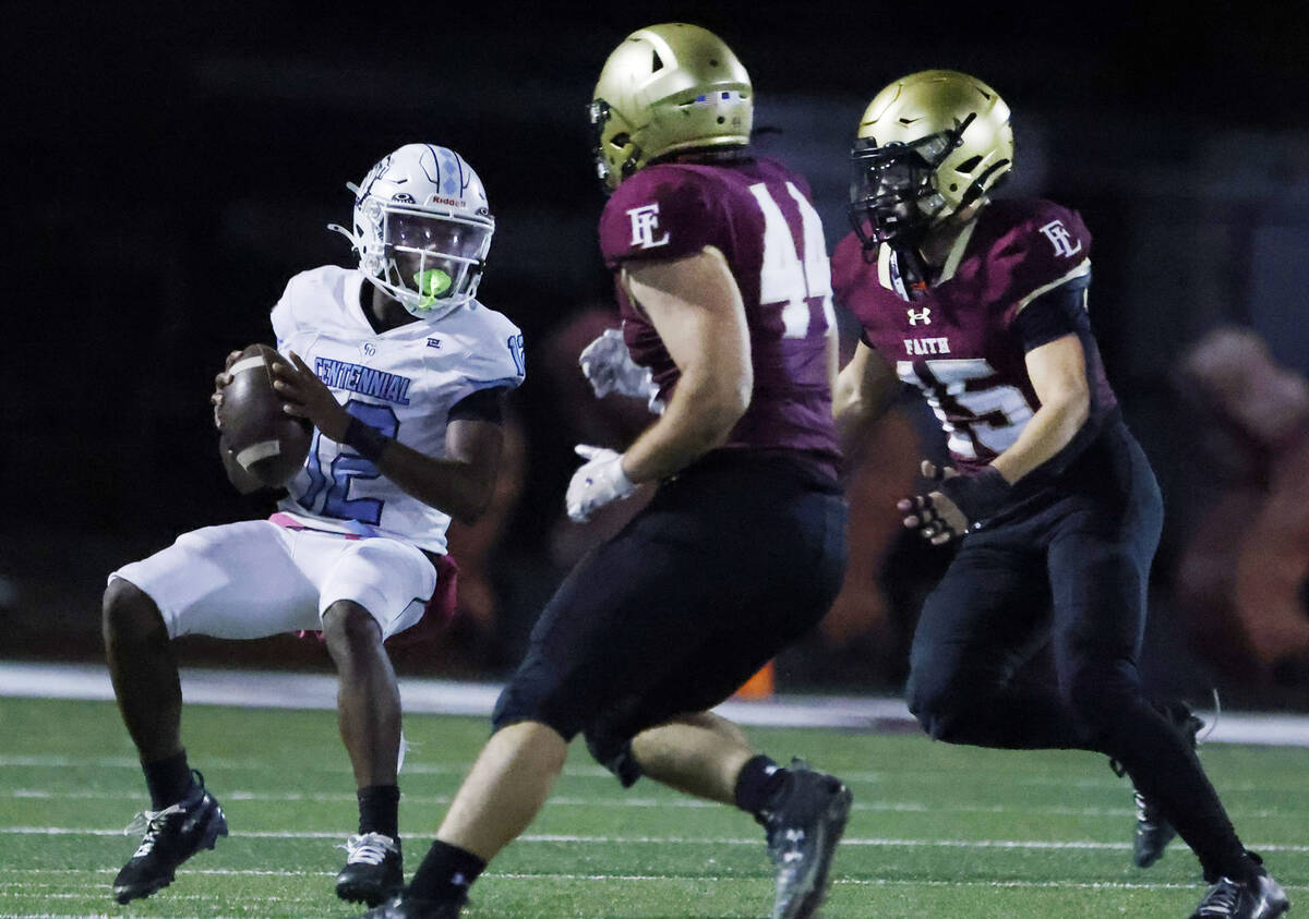 Centennial quarterback Nehemiah Dunlap-myvett (12) is chased by Faith Lutheran defensive lineme ...