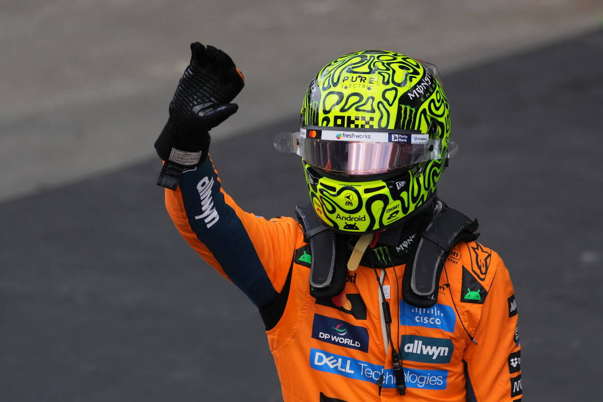 McLaren driver Lando Norris of Britain celebrates finishing first during the qualifying session ...