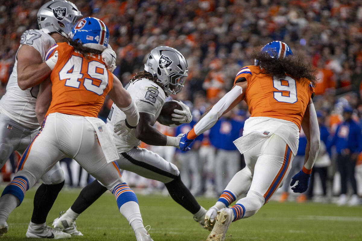 Raiders running back Ashton Jeanty (2) runs for the end zone against Denver Broncos safety Tala ...