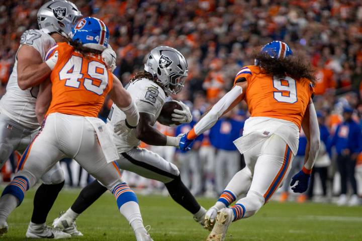 Raiders running back Ashton Jeanty (2) runs for the end zone against Denver Broncos safety Tala ...