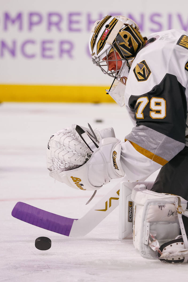 Goaltender Carter Hart warms up before the Silver Knights’ game against the Calgary Wran ...