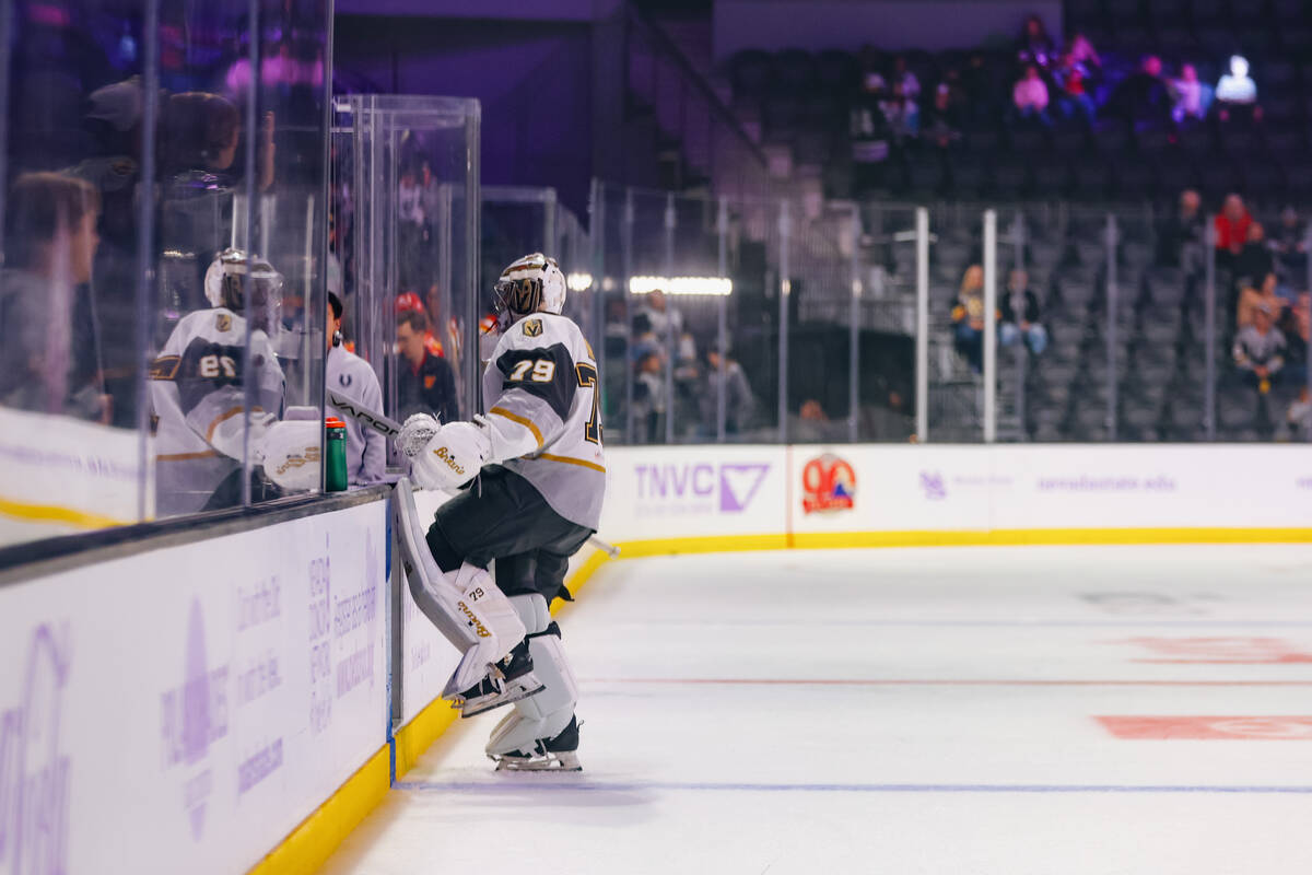 Goaltender Carter Hart warms up before the Silver Knights’ game against the Calgary Wran ...