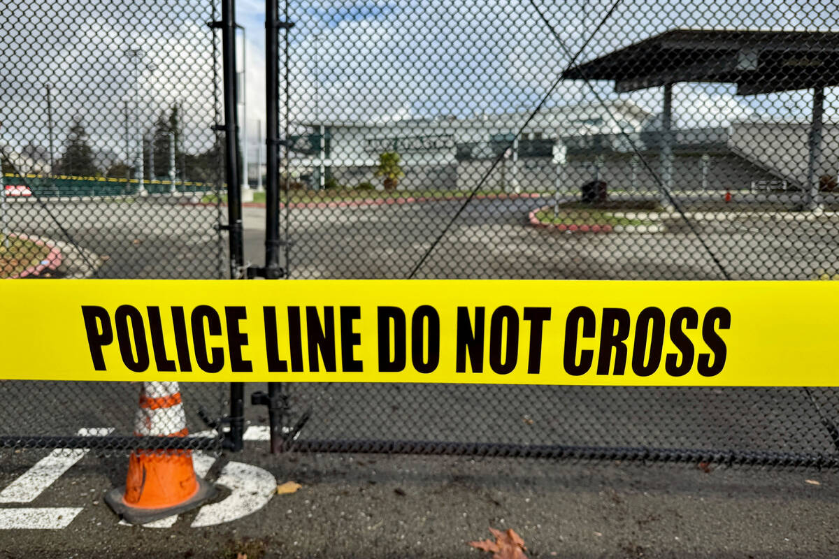 Crime scene tapes ropes off an area one day after a shooting at Laney College in Oakland, Calif ...