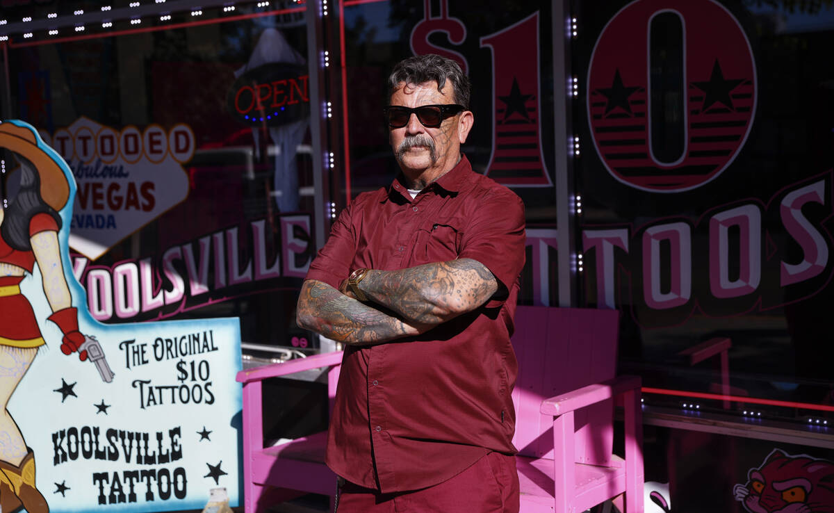 Robert Gonzalez, who owns Koolsville Tattoos with wife Mari Gonzalez, poses for a portrait outs ...
