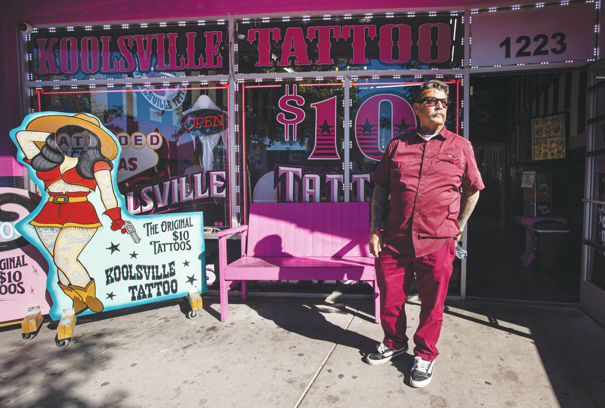 Robert Gonzalez, who owns Koolsville Tattoos with wife Mari Gonzalez, poses for a portrait outs ...