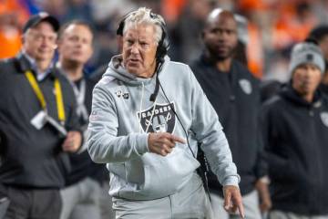 Raiders head coach Pete Carroll reacts to a penalty flag thrown during the first half of an NFL ...