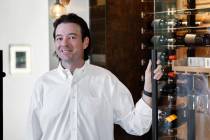 Eric Murphy, owner of Las Vegas Wine Cellars, poses for a portrait in front of a refrigerated w ...