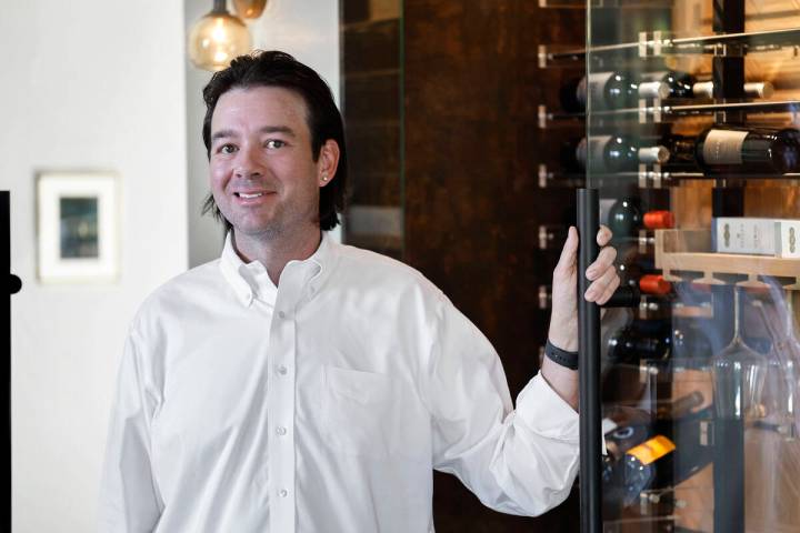Eric Murphy, owner of Las Vegas Wine Cellars, poses for a portrait in front of a refrigerated w ...