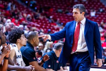 UNLV head coach Josh Pastner points to UNLV guard Al Green (7) on the bench against the UT Mart ...