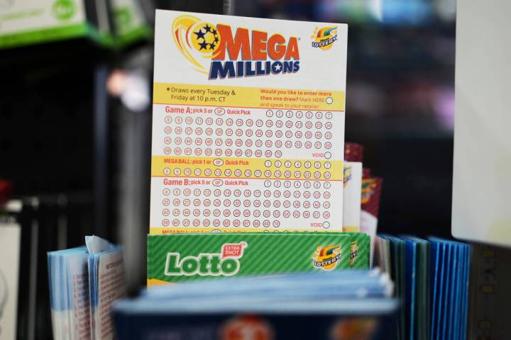 Mega Millions Lottery play slips are displayed for customers at a convenience store in Chicago, ...